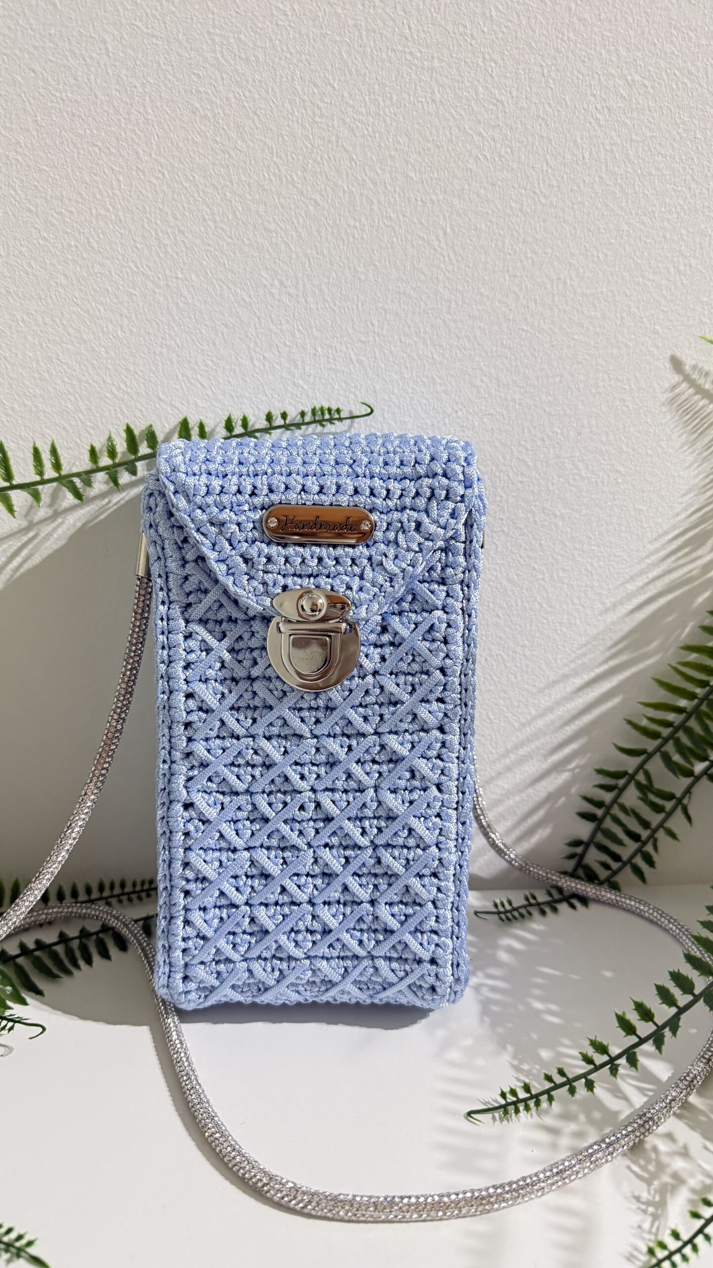 Handmade crochet phone bag in powder blue with silver chain strap